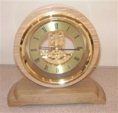 Skeleton clock set in oak by Graham Holcroft